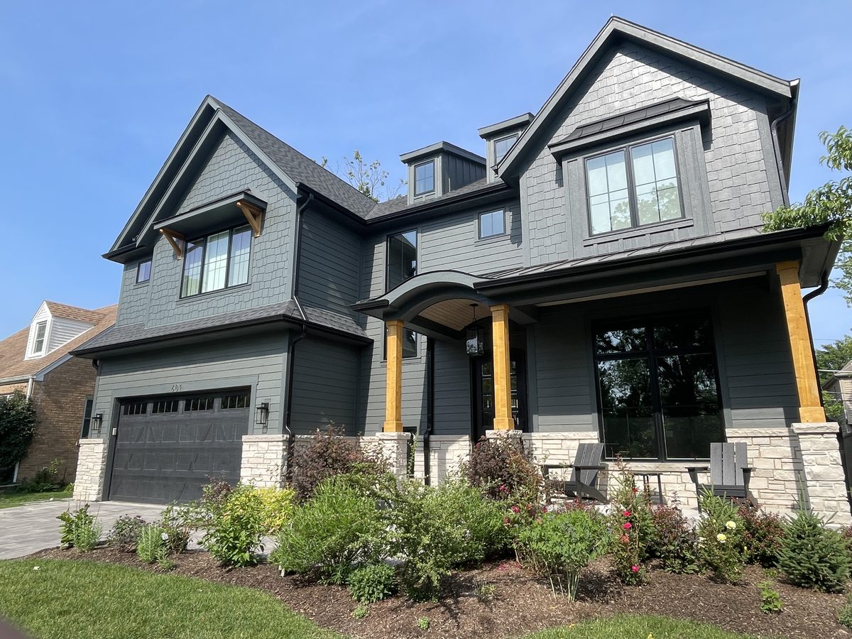 Large grey shingle home in Chicago suburbs